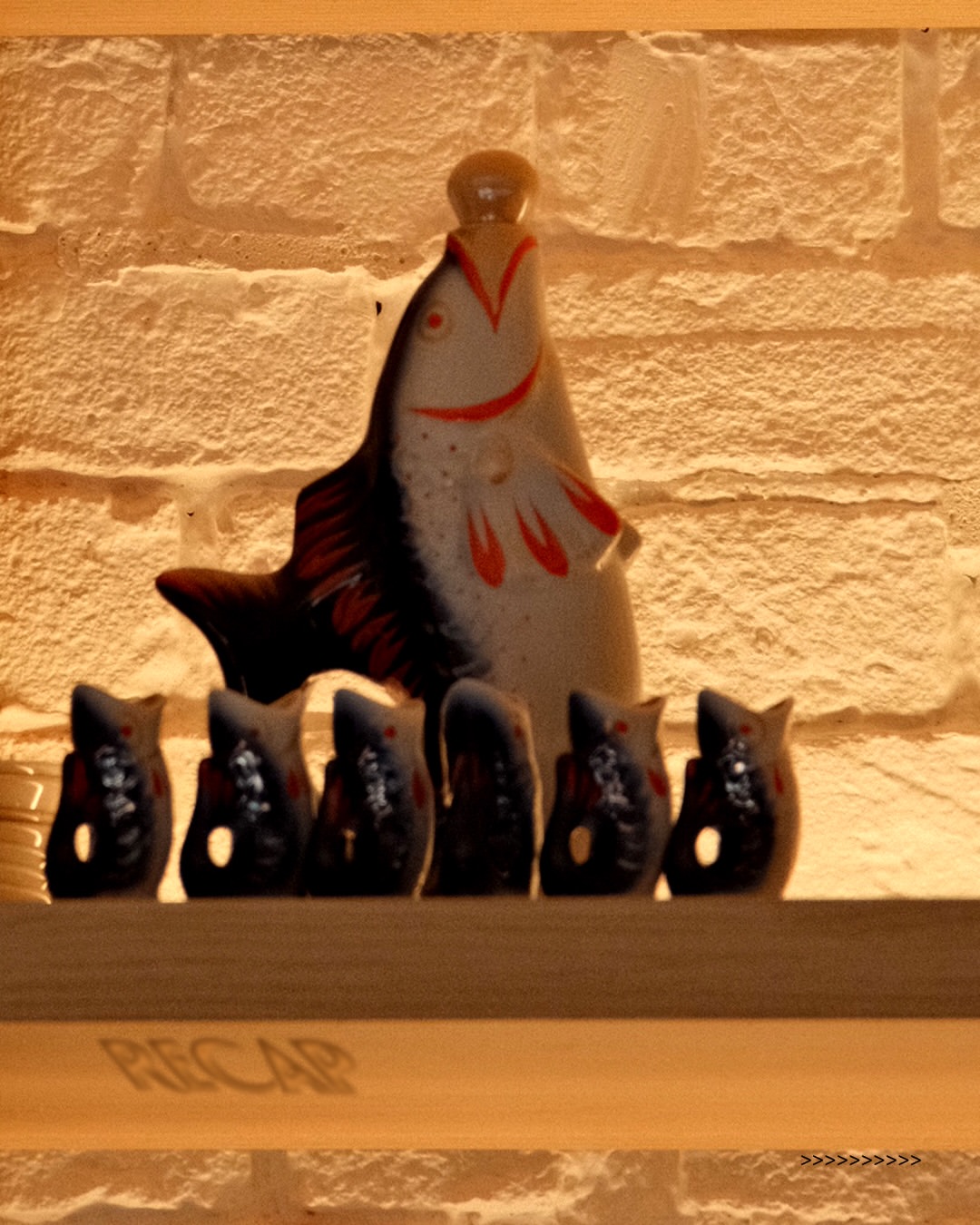 Fish figurines on a shelf inside BIBELOT bar