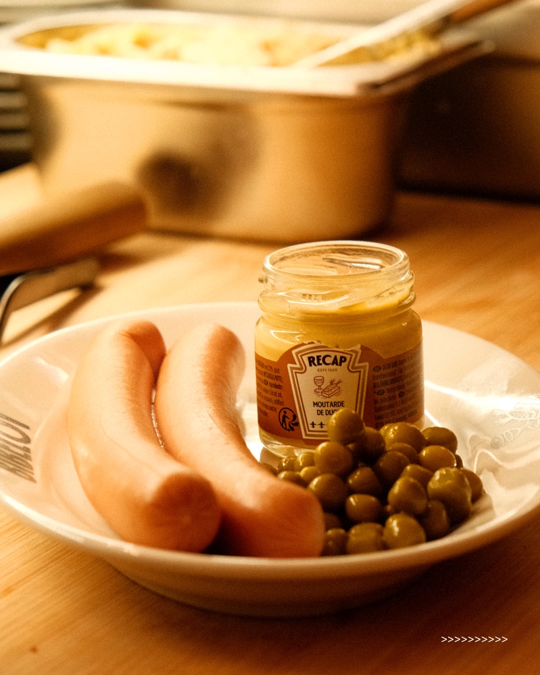 Sausages with mustard and olives served at BIBELOT bar